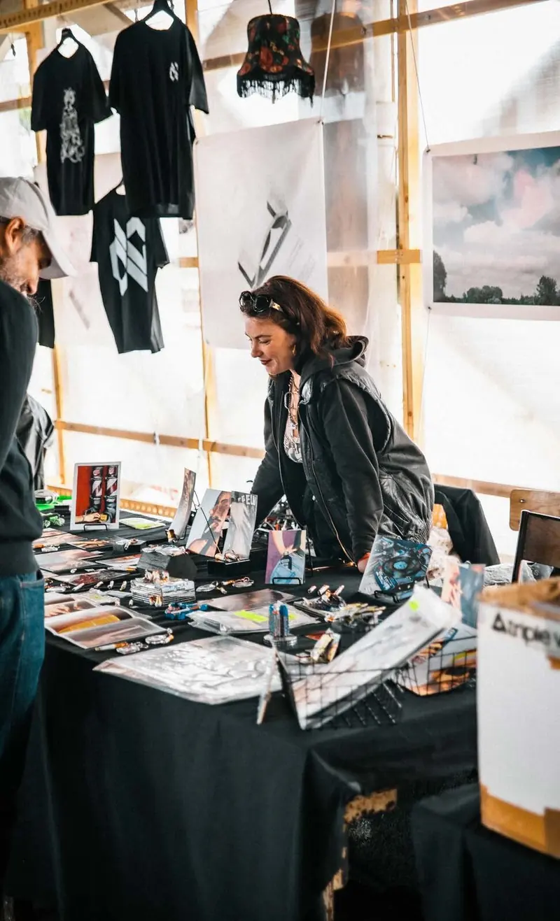 Merch stand at a festival, Paris Electronic Week - Technopol, La Cité Fertile, 2026. Photo by Iheb Fehri