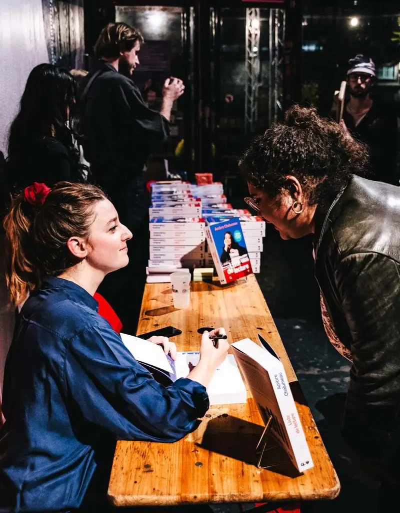 Author signing books, “Liste de lecture” Ambre Chalumeau release party, Iconoclaste, Point Éphémère, Paris, 2025. Photo by Iheb Fehri