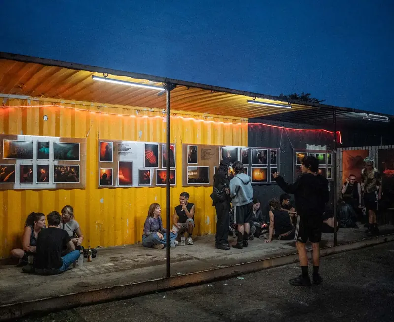 Prints on a yellow container at dusk. Photo by Iheb Fehri